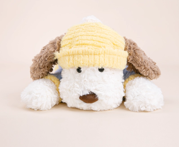 Cute stuffed animal with a lying dog