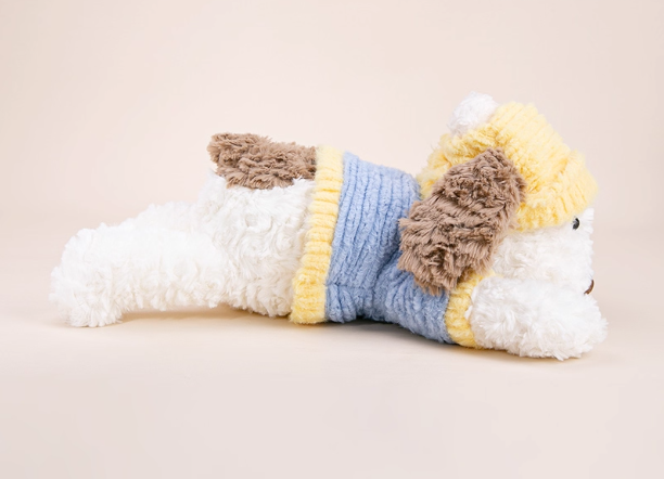 Cute stuffed animal with a lying dog